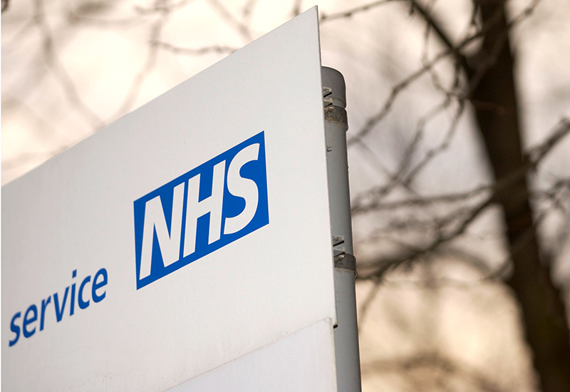 NHS card and model torso used in health education